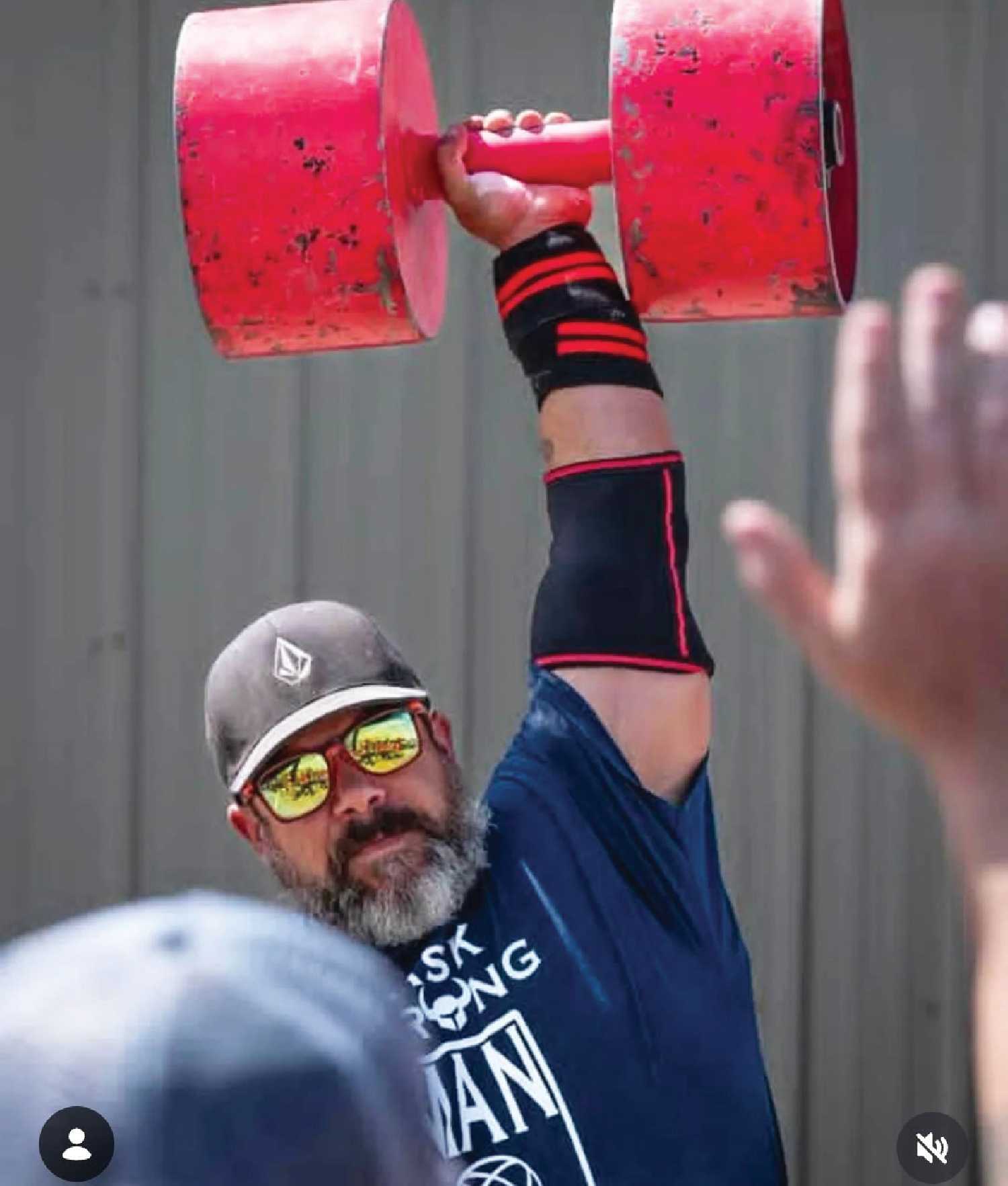 This dumb bell weighs 130 pounds, and Kaylan Rekken lifted it with one arm three times on each side to become the Strongman champion.